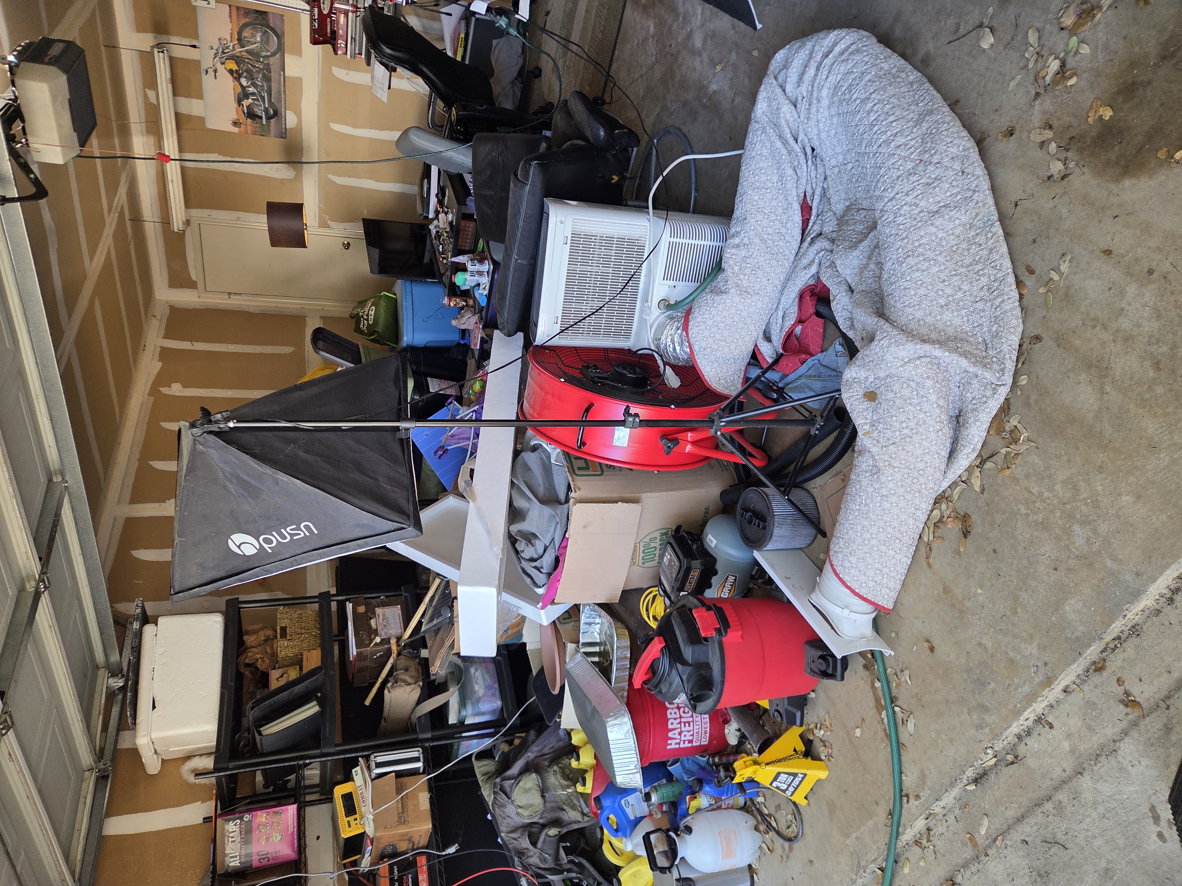 Cluttered garage before junk removal Brushy Creek TX