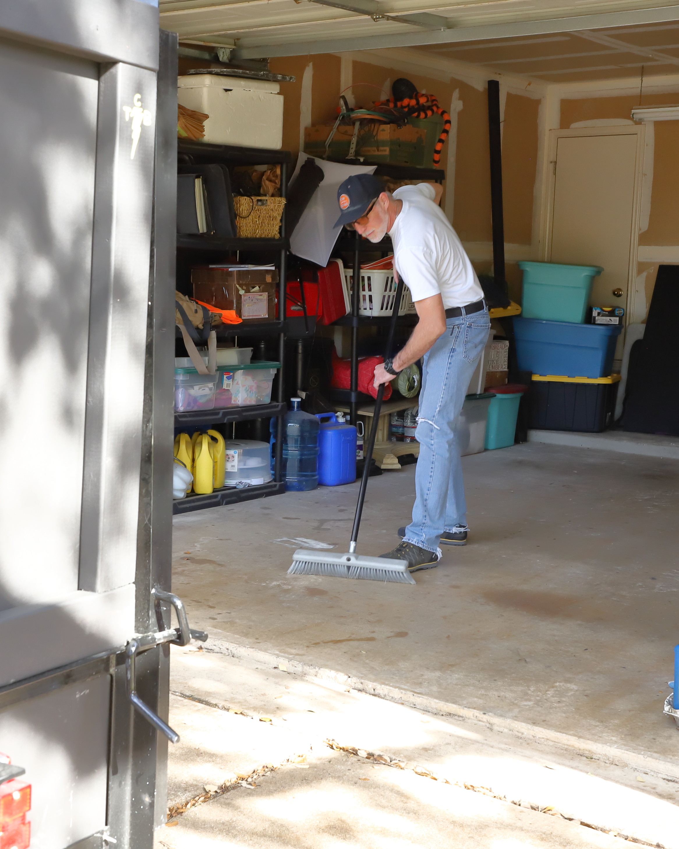 Sean loading trailer for Brushy Creek junk removal